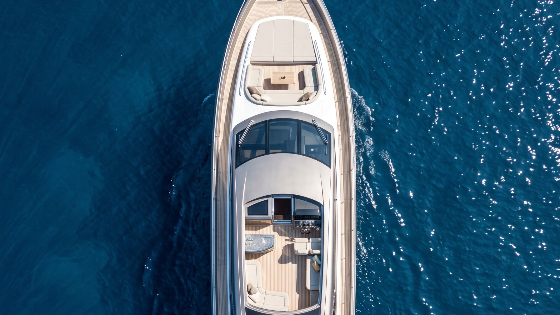 Aerial view of a marina estate in a mountain-ringed bay